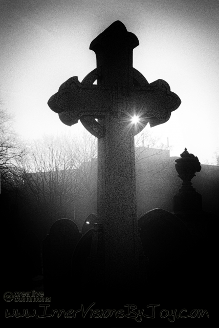Celtic grave marker at sunet in black and white