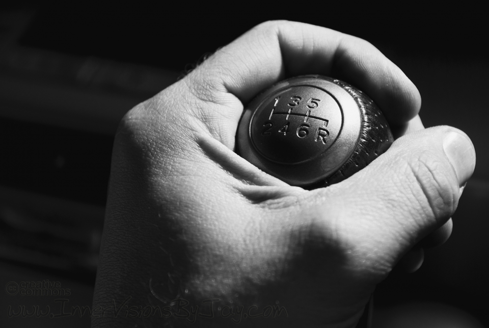 Charge of the Jolly Roger Black and white image of hand holding gearshitft