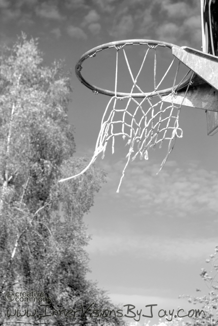 Essence and Descent Tattered basketball net in black and white post-apocalyptic image