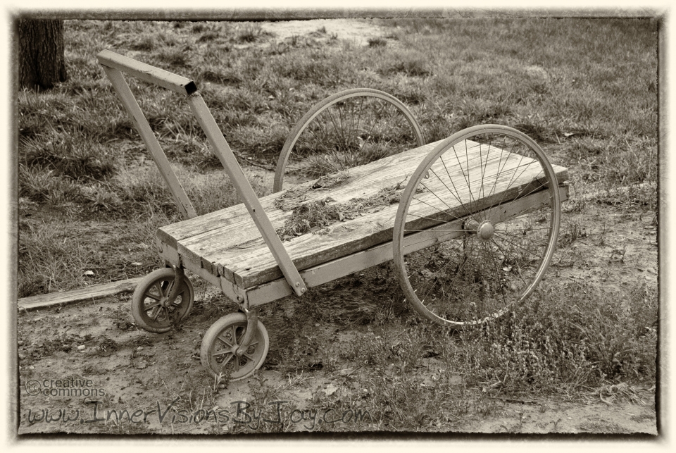 Abandoned antique pushcart in sepia