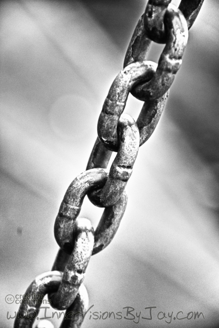 Mansion and Hovel Chains in black and white against glowing background