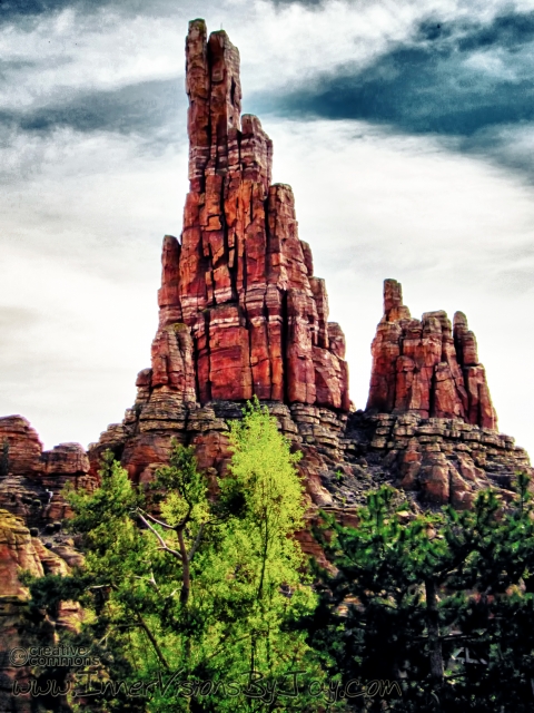 Redrock Ascension Red desert finger mountain against surreal dusk sky