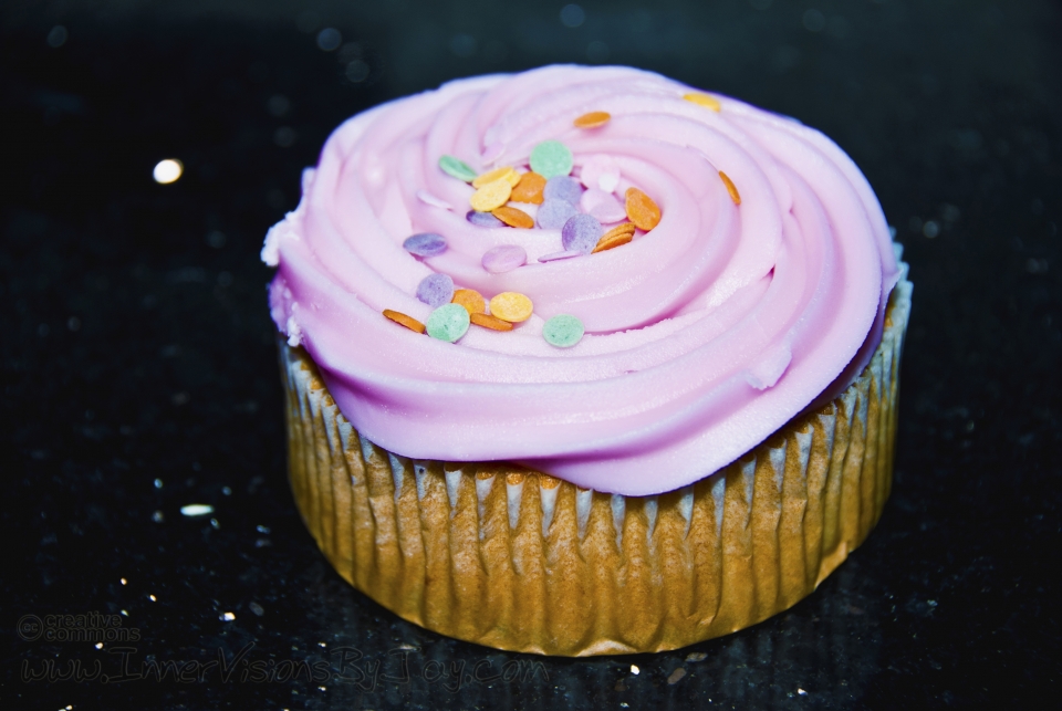 Pink cupcake with sweet discs
